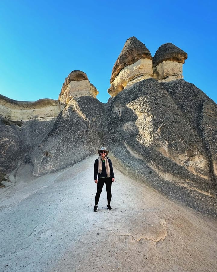 Clara Ritger poses for a picture in front of Cappadocia's famous Fairy Chimneys in Turkey.