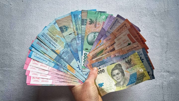 Over one million Indonesian rupiah in cash fanned out.